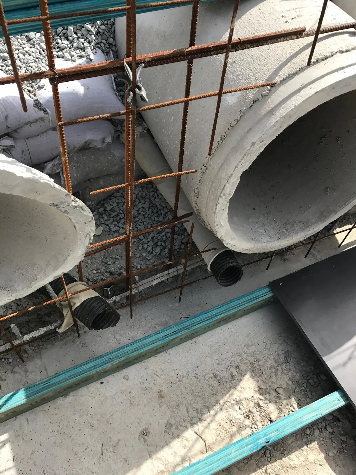Reinforcement tied around large concrete pipes