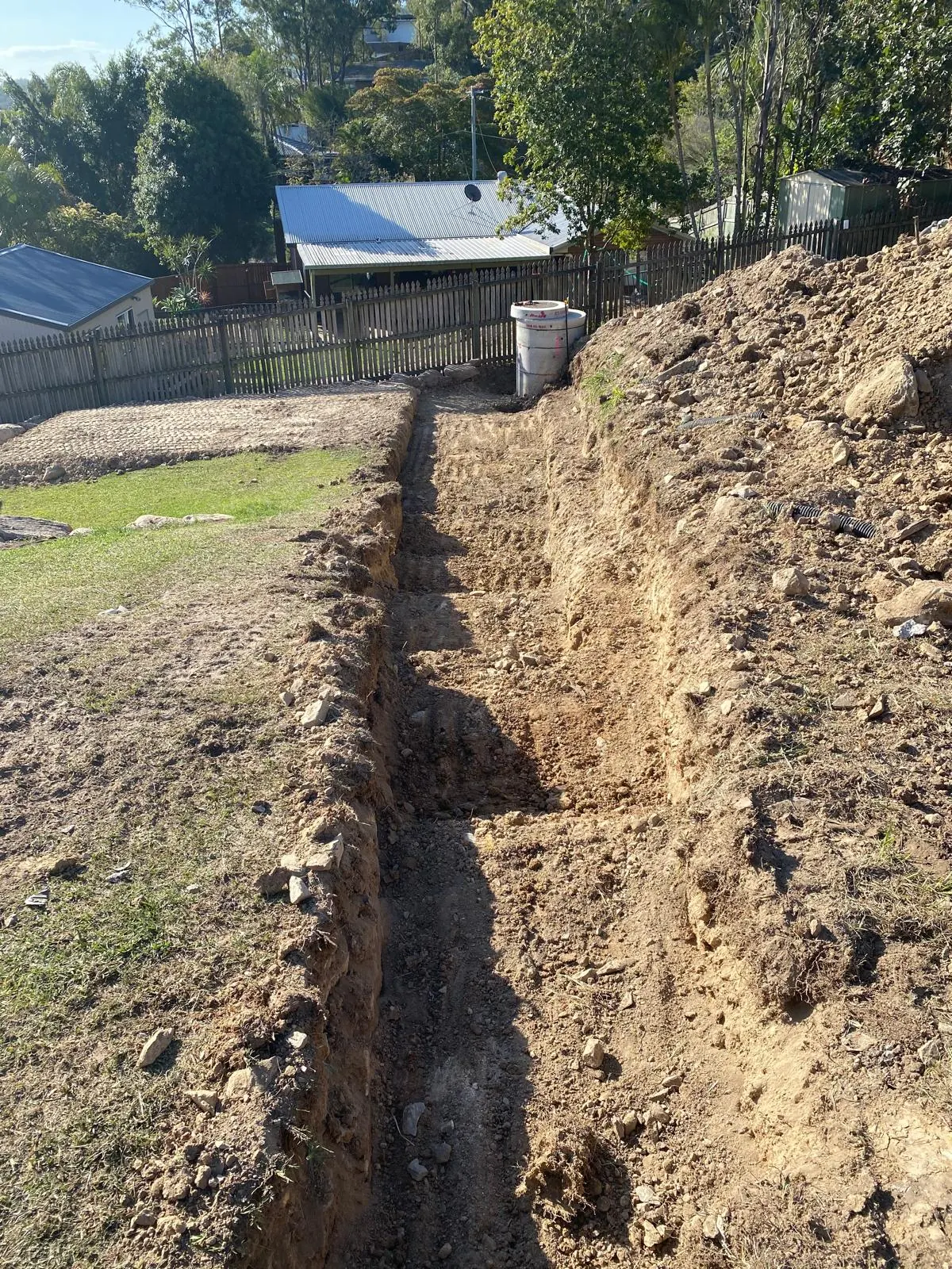 Excavated trench on a house block