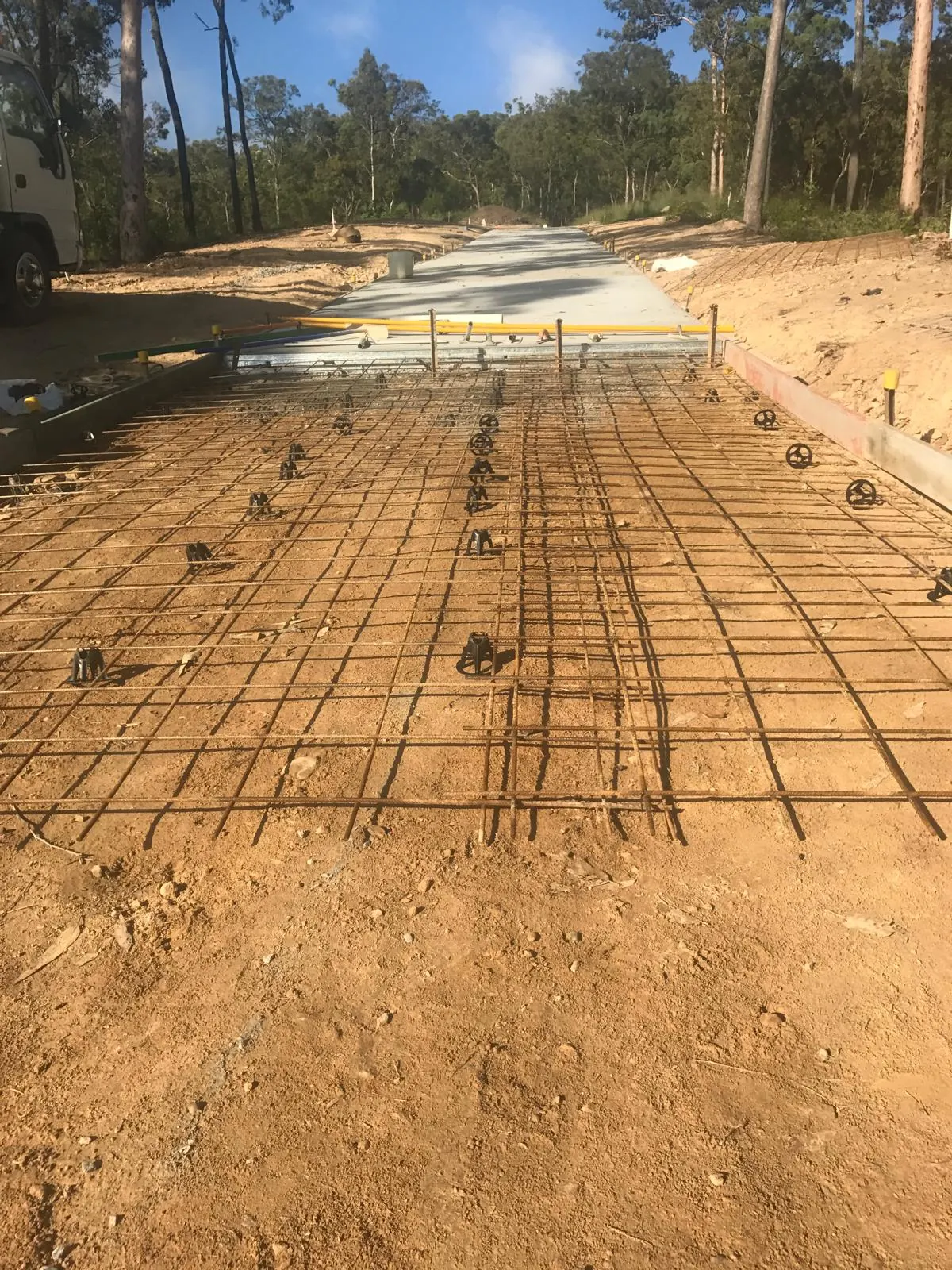 Access road with mesh ready and a finished bay beyond