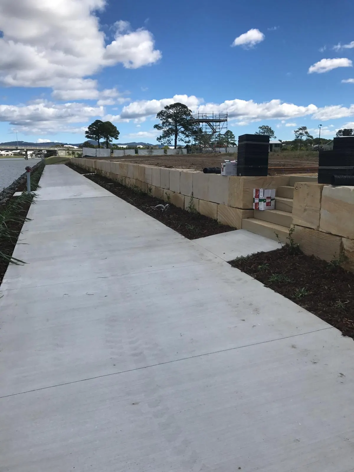 Block retaining wall and concrete path
